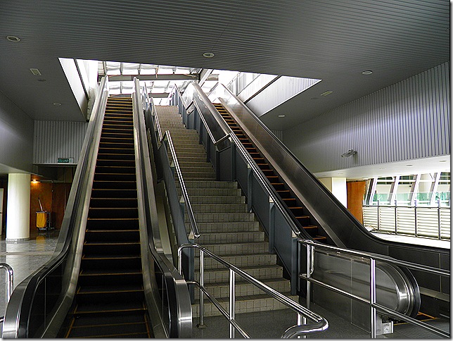 Escalators to monorail platform.